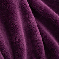 Close up of a purple extra fluffy throw.