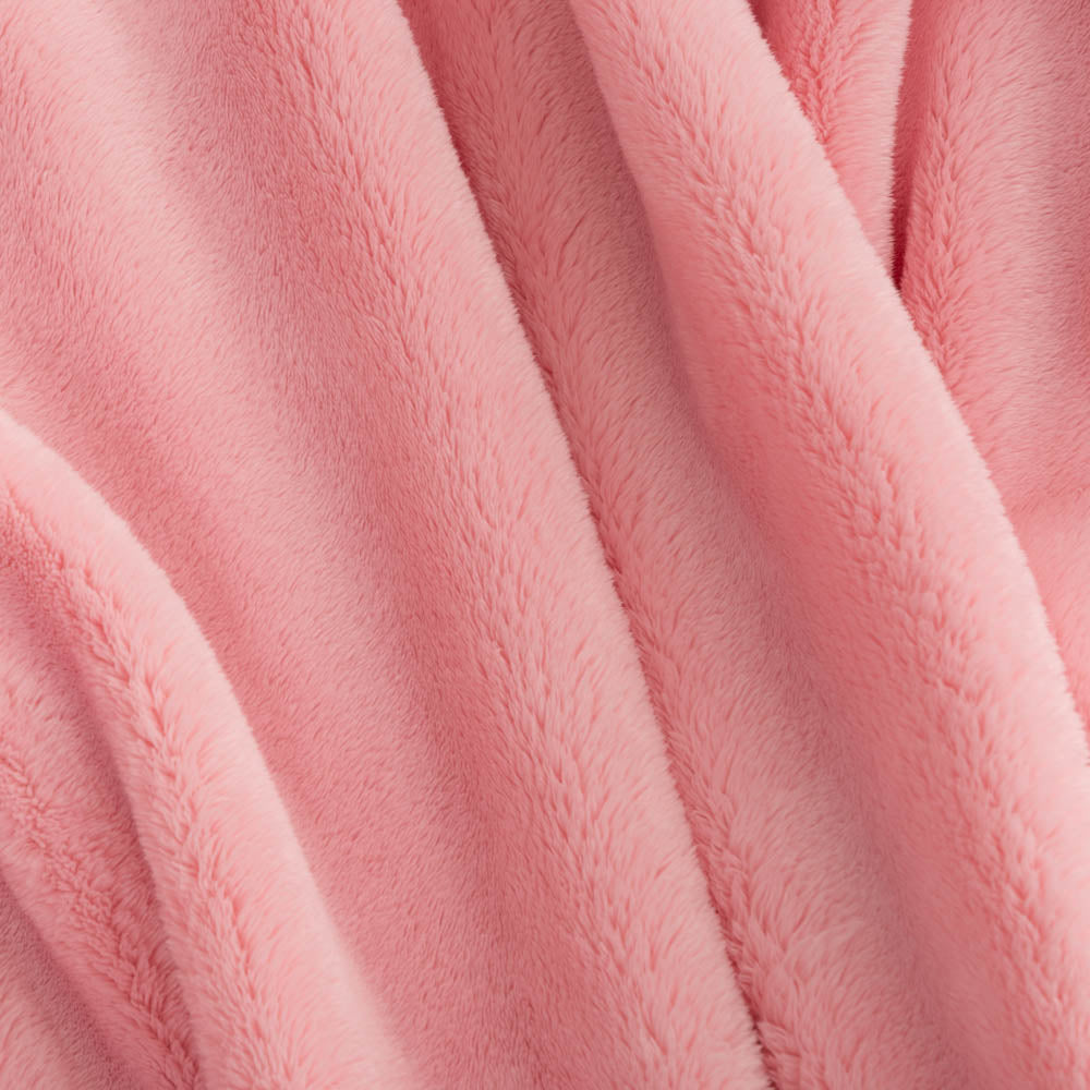 Close up of a pink extra fluffy throw.