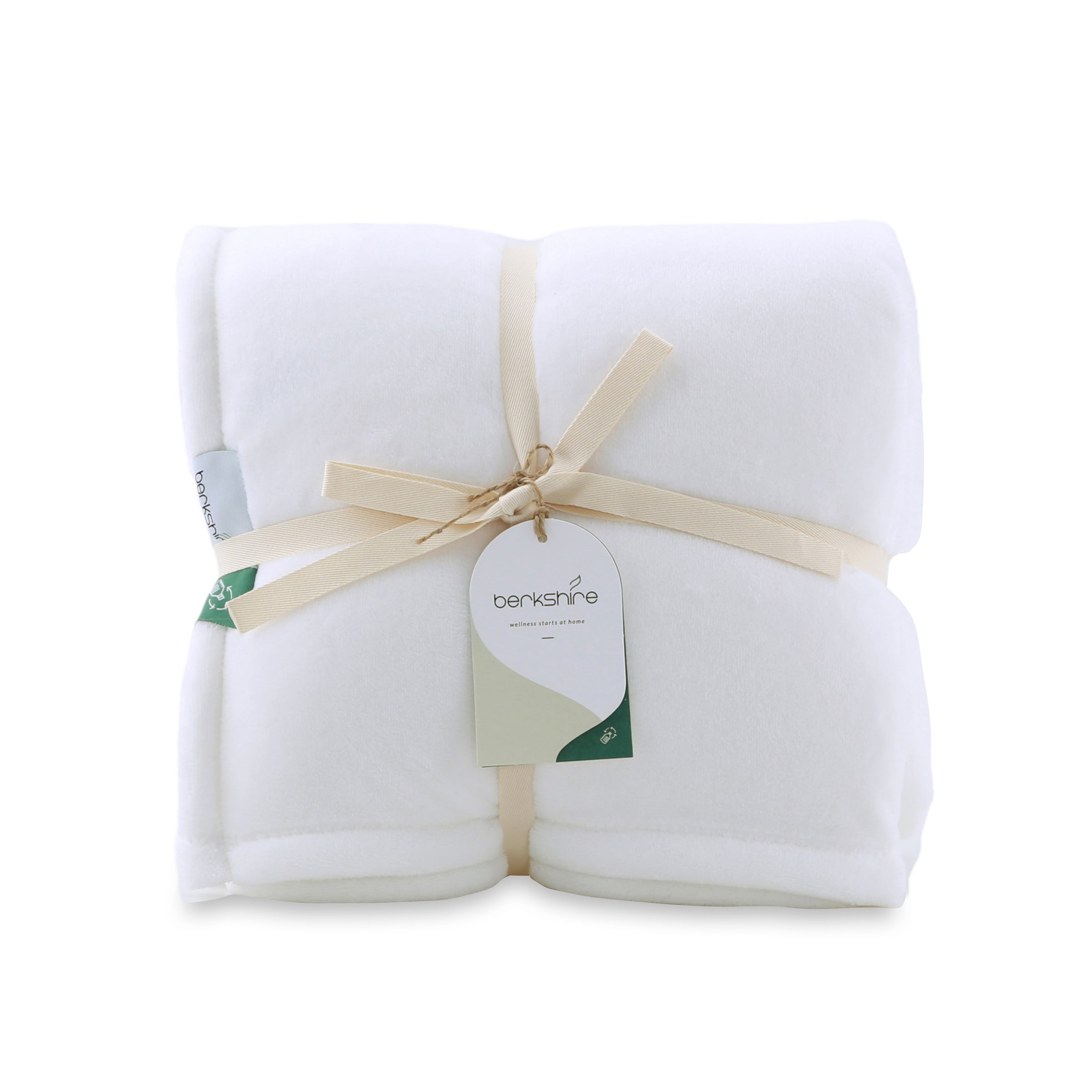 Packaged picture of a white velvety plush throw secured neatly with a bow and a hang tag.