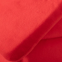 Close up of our red Peanuts Snoopy Dog house pet bed's fabric.