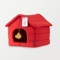 Side angle view of our red Peanuts Snoopy Dog House Pet Bed.
