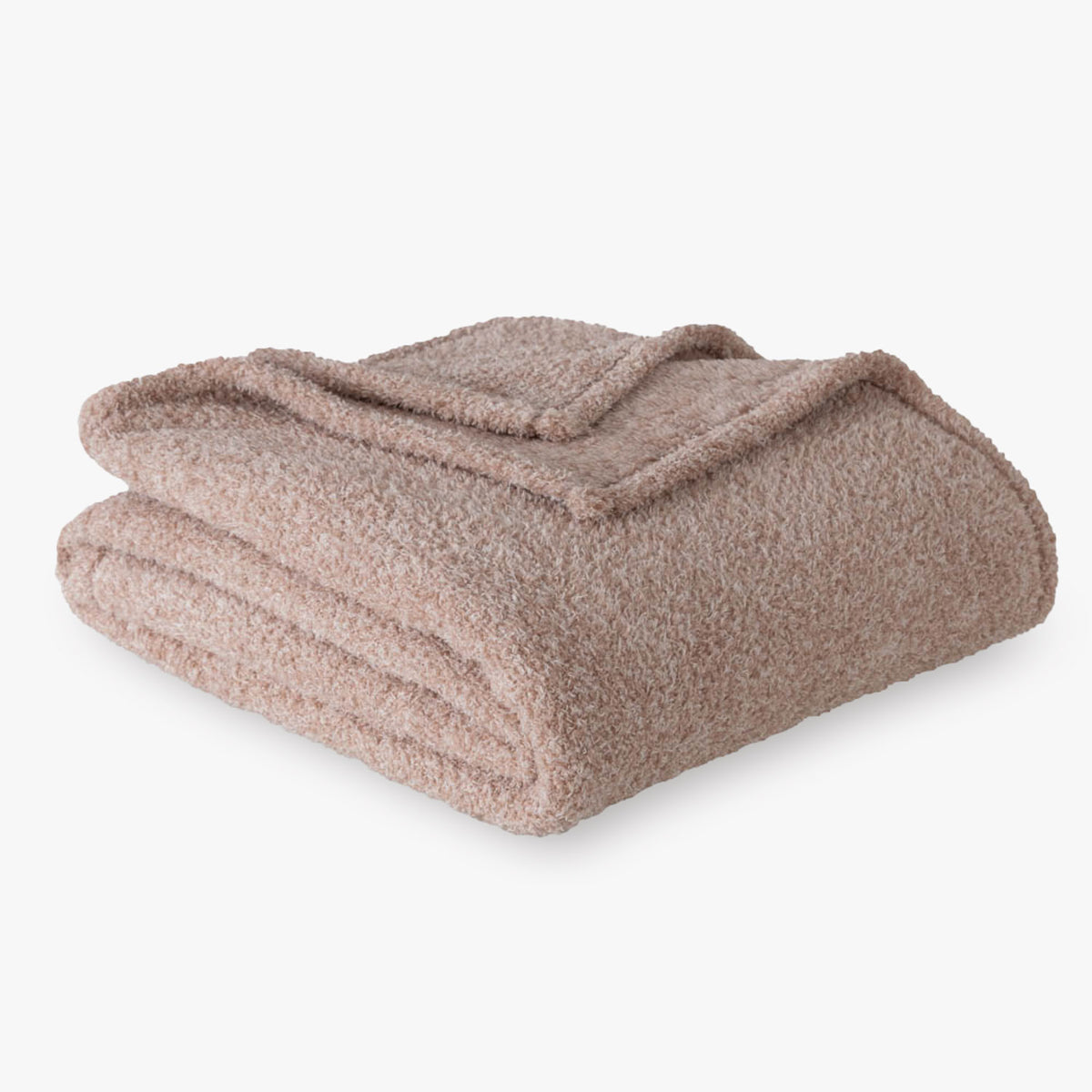 Folded pink blanket on a white background
