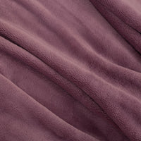 Close up of a purple PrimaLush throw, isplaying its smooth and plush texture.