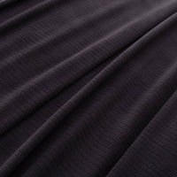 Close-up of the black fabric’s soft and textured microfleece material.