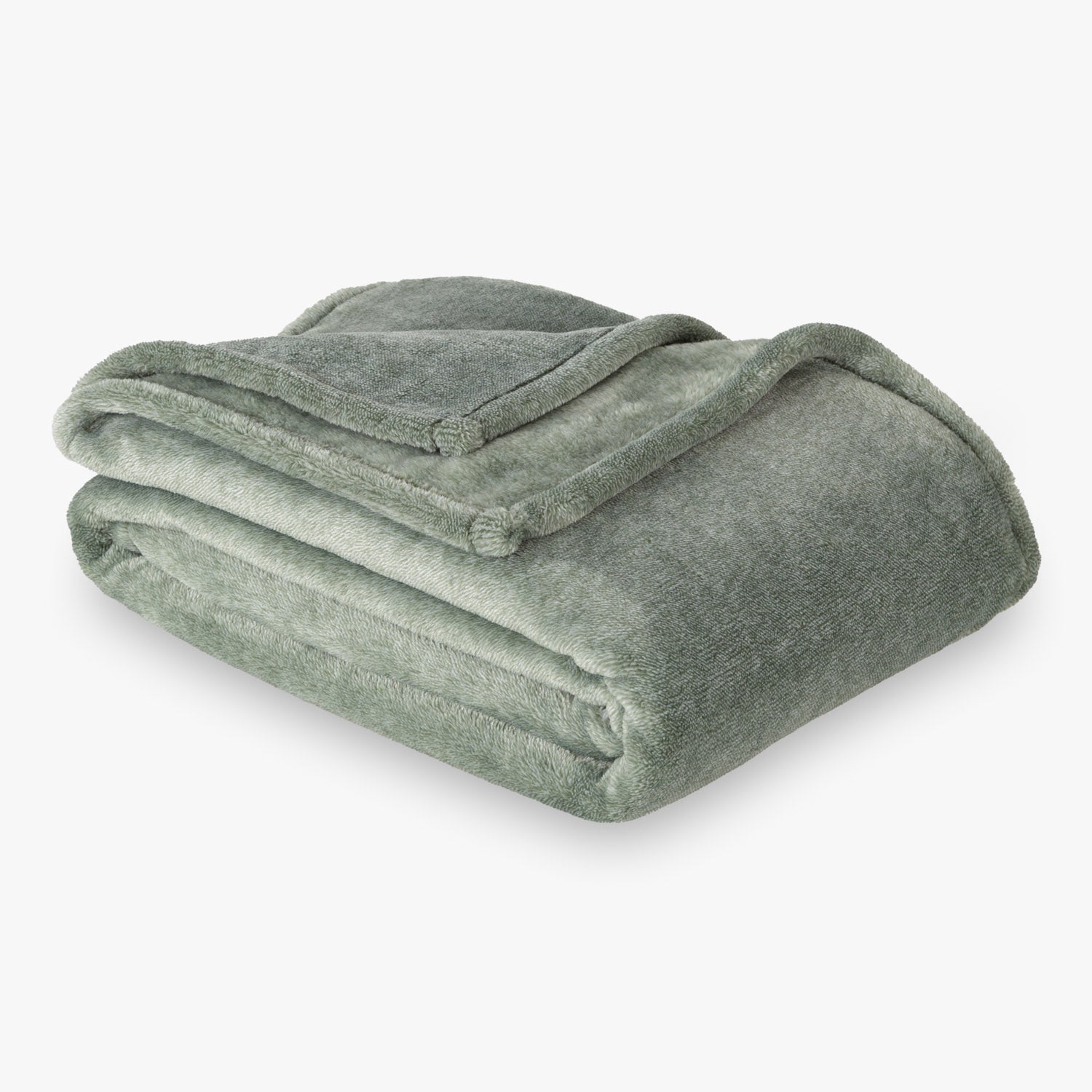 Folded green blanket on a white background