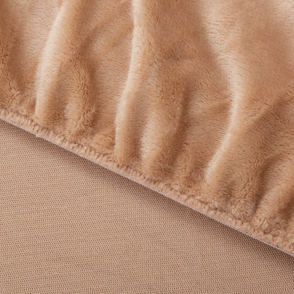 Close-up of a plush Aruba Sand fitted sheet corner.