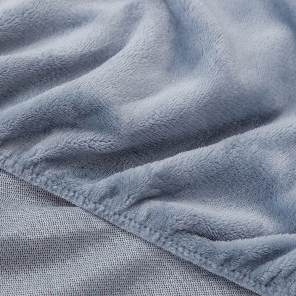 Close-up of Polar Blue (light blue) fitted sheet corner with plush texture.