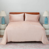 Rose Smoke sheet set neatly made  on a bed.