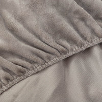 Close-up of Wild Dove fitted sheet corner with plush texture.