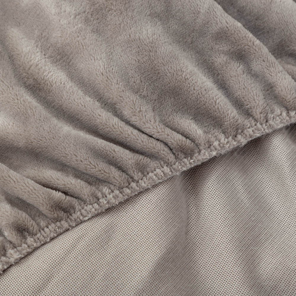 Close-up of Wild Dove fitted sheet corner with plush texture.