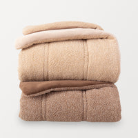 Two folded folded Retro Plush comforters stacked in a clean, organized display on white background.
