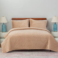 A bed made with the Linen VelvetLoft® Quilt Set, showcasing a clean and crisp bedding arrangement.
