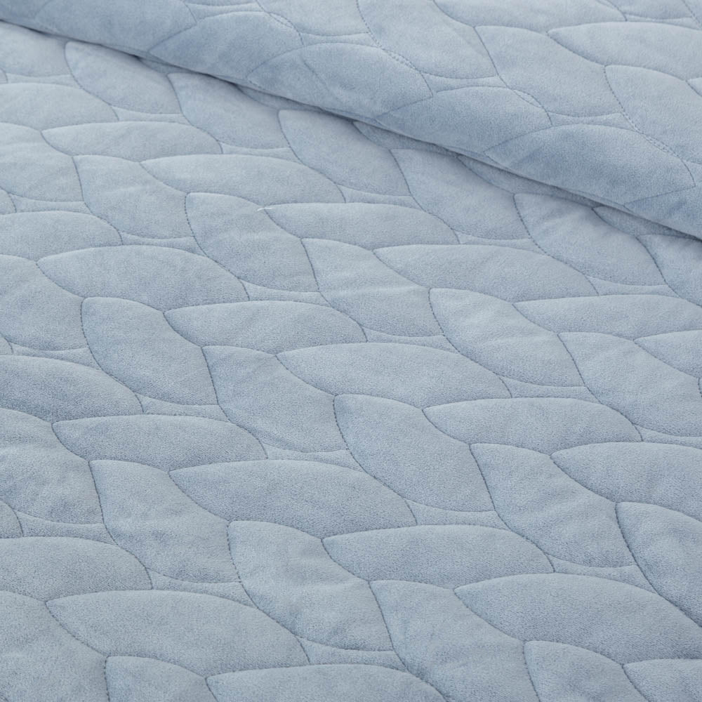 Close-up of the Polar Blue VelvetLoft quilting patten detail and VelvetLoft® fabric, highlighting the silky, textured design.