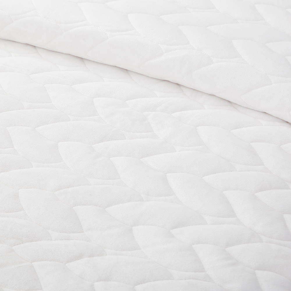 Close-up of the  White VelvetLoft quilting patten detail and VelvetLoft® fabric, highlighting the silky, textured design.