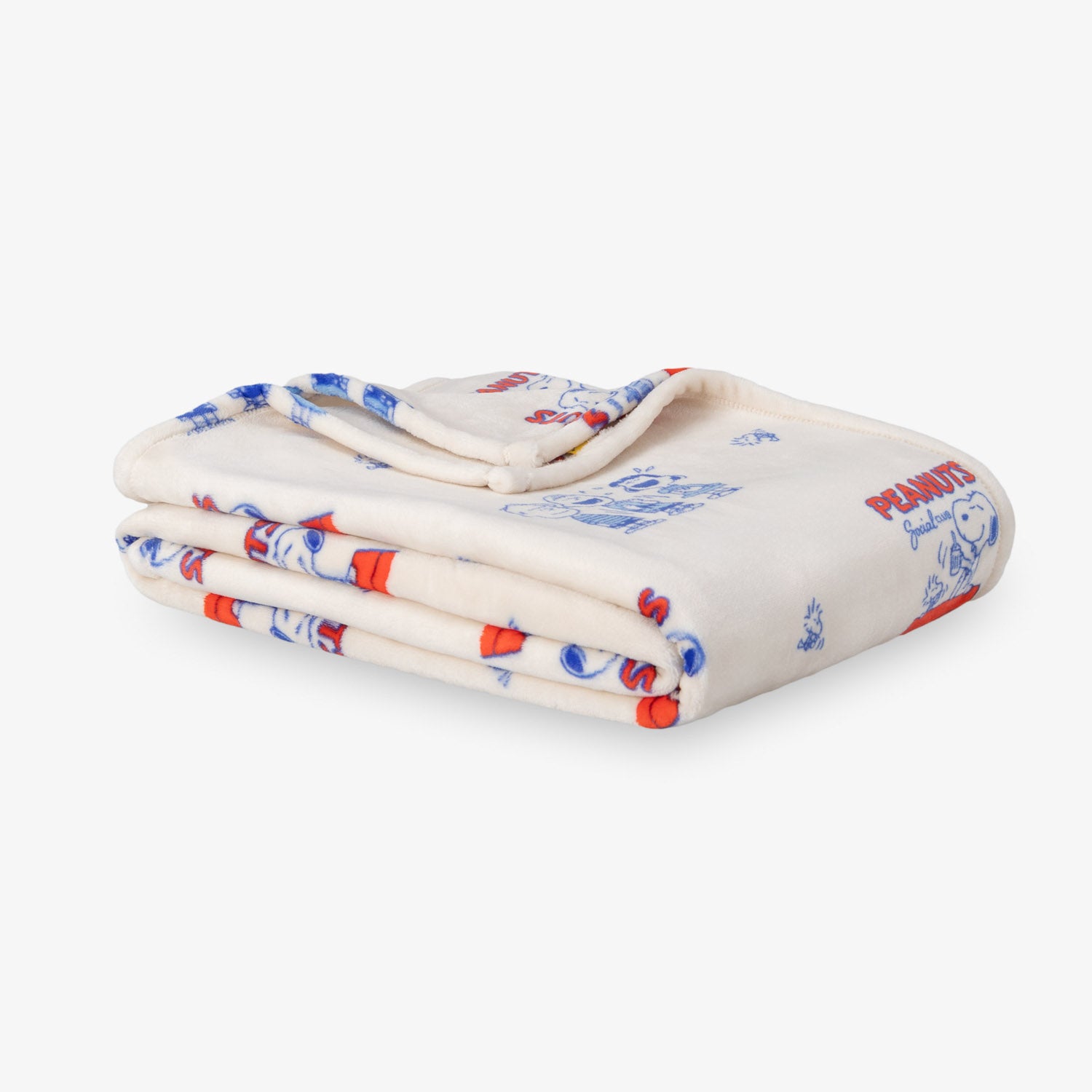 Printed Peanuts 75th Anniversary throw folded neatly on a white surface.