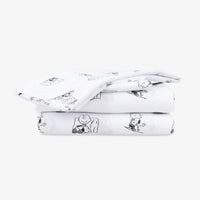 Peanuts printed microfiber sheet set folded neatly on a white surface.