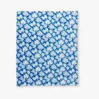 Krissy Mast Artist Series printed hydrangea print throw laid flat on a white surface.