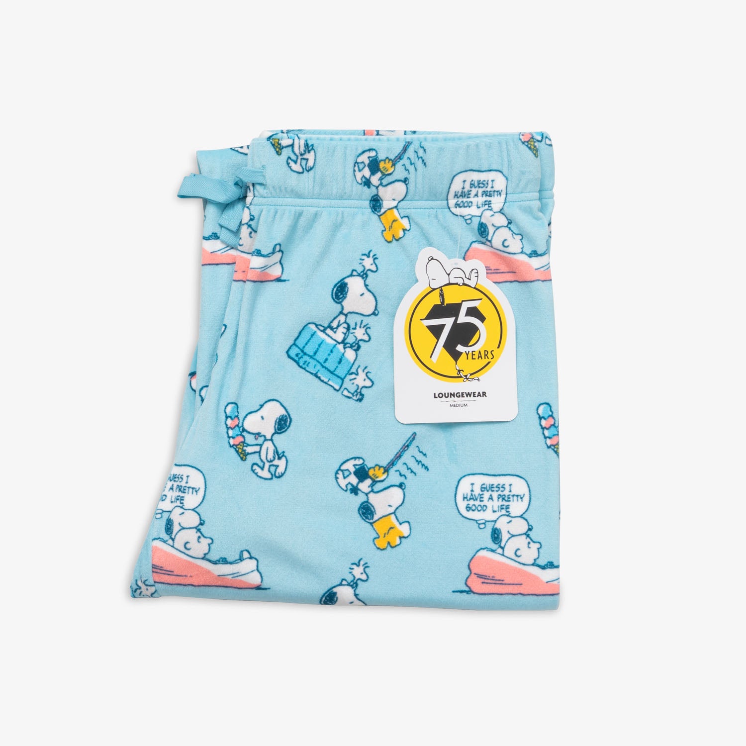 Peanuts 75th Anniversary printed lounge pants folded neatly on a white surface.