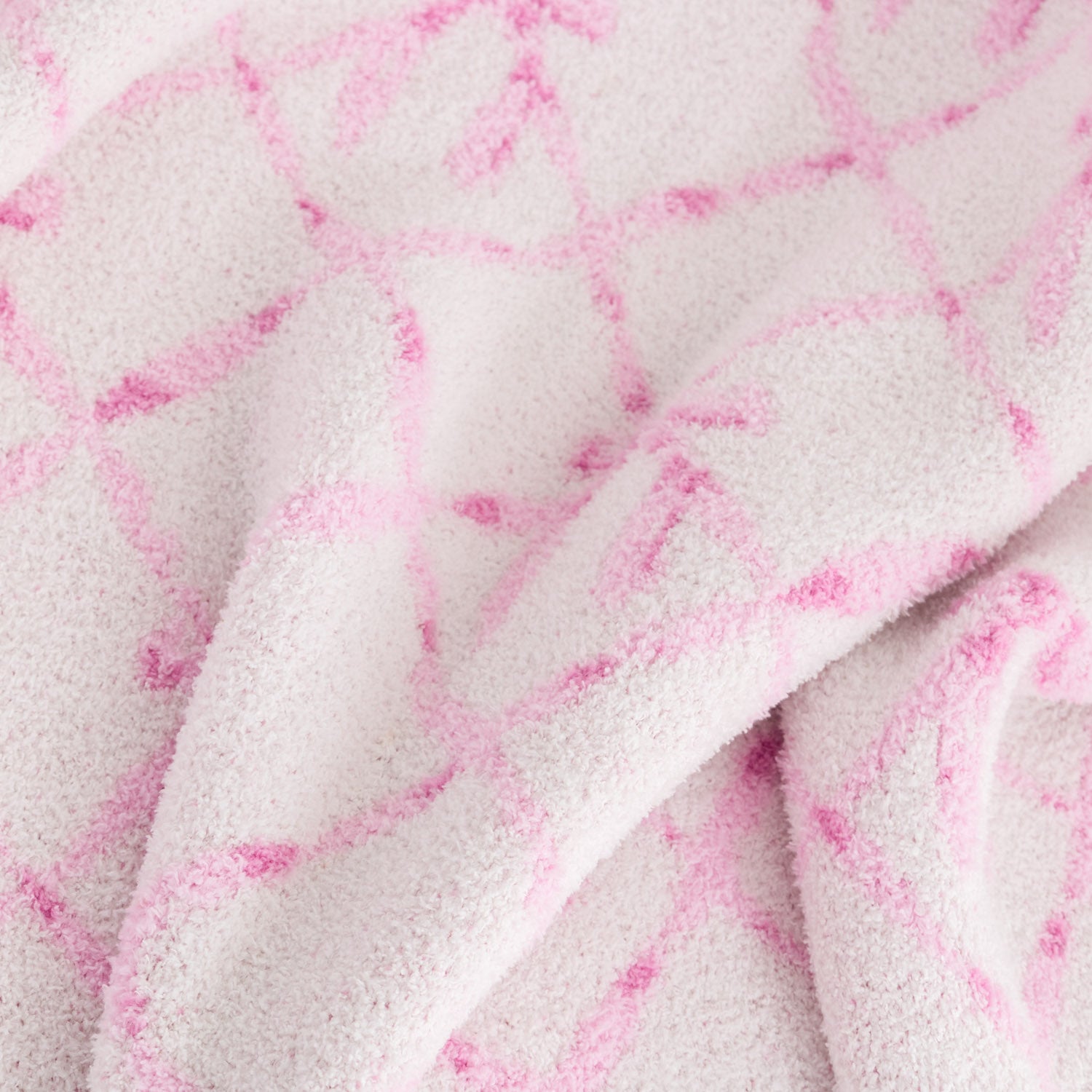 Close up of a Krissy Mast Mellowsoft Bow Throw.