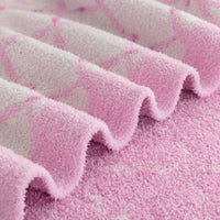Close up of a Krissy Mast Mellowsoft Bow Throw.