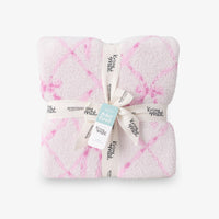 Krissy Mast Mellowsoft Bow Throw folded neatly on a white surface.