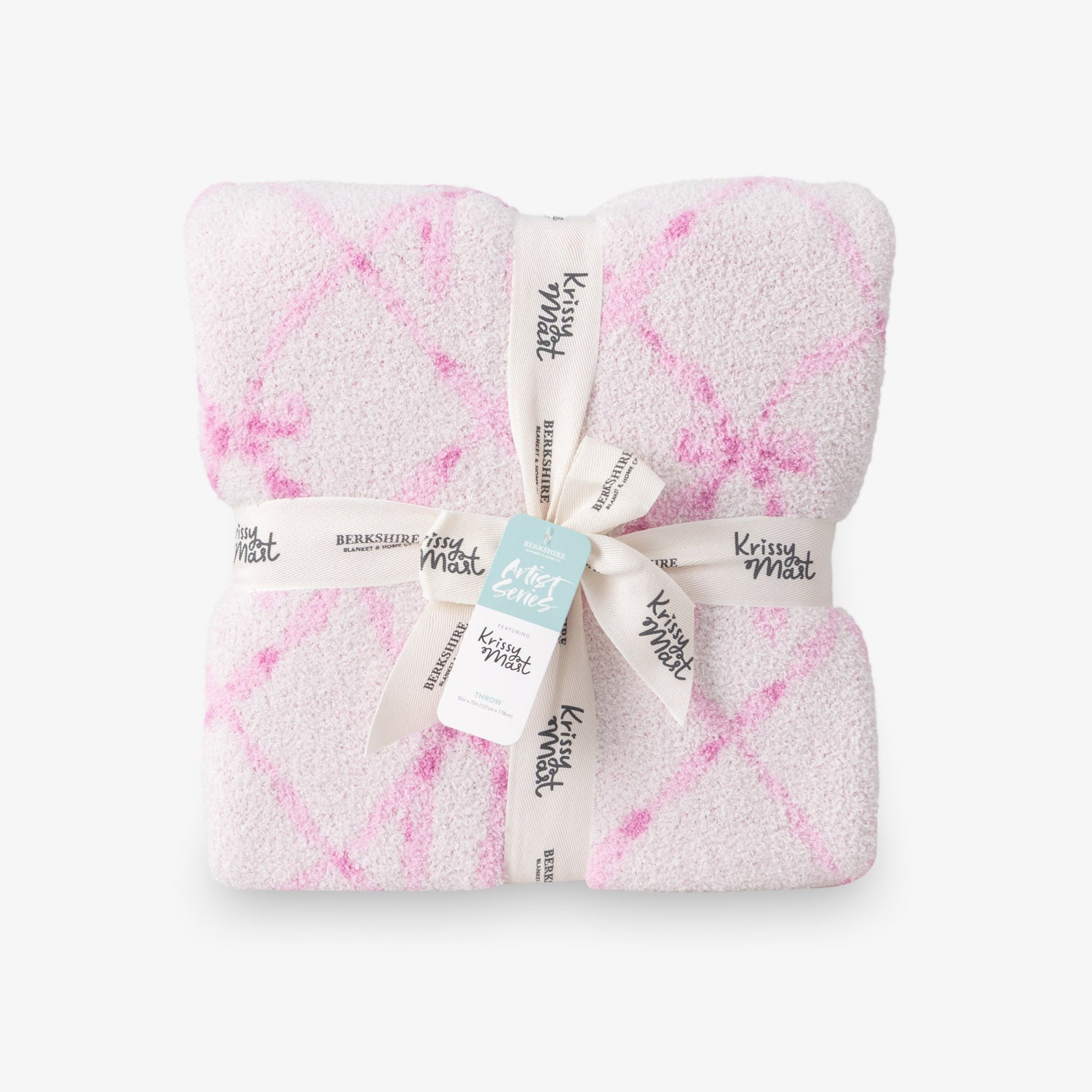 Krissy Mast Mellowsoft Bow Throw folded neatly on a white surface.