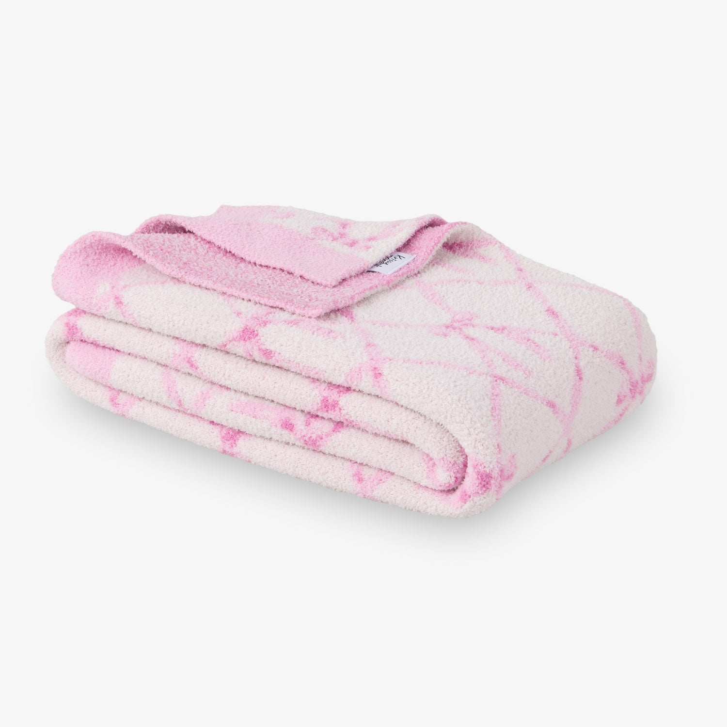 Pink and white tie-dye blanket on a white background