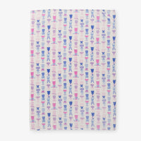 Cocktail and bows printed velvetloft throw laid flat on a white surface.