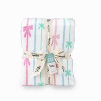 Folded blanket with colorful Bow stripe patterns and brand labels on a white background