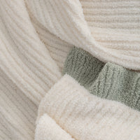 Close-up of a textured fabric with neutral colors