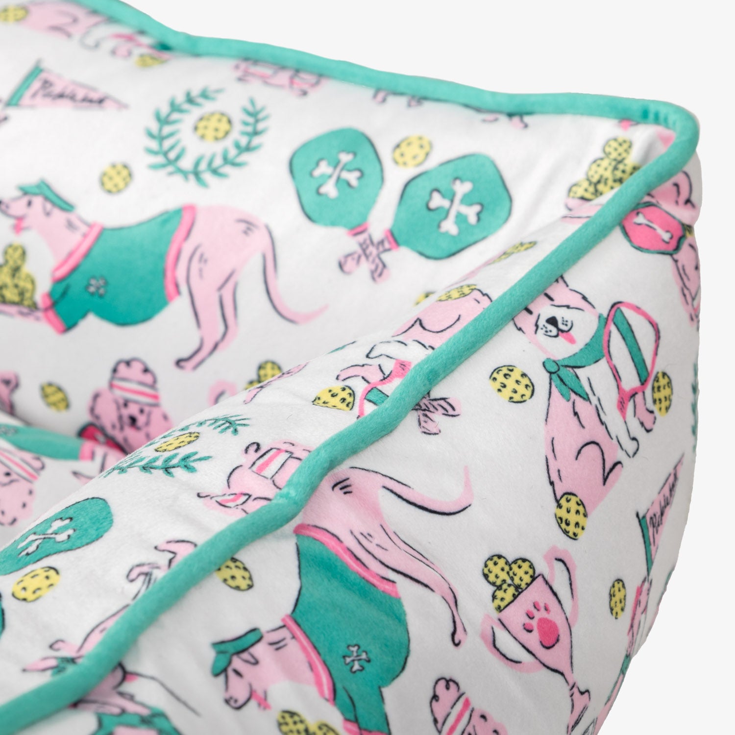 Pickleball pups pet bed set on a white surface.