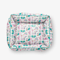 Pickleball pups pet bed set on a white surface.