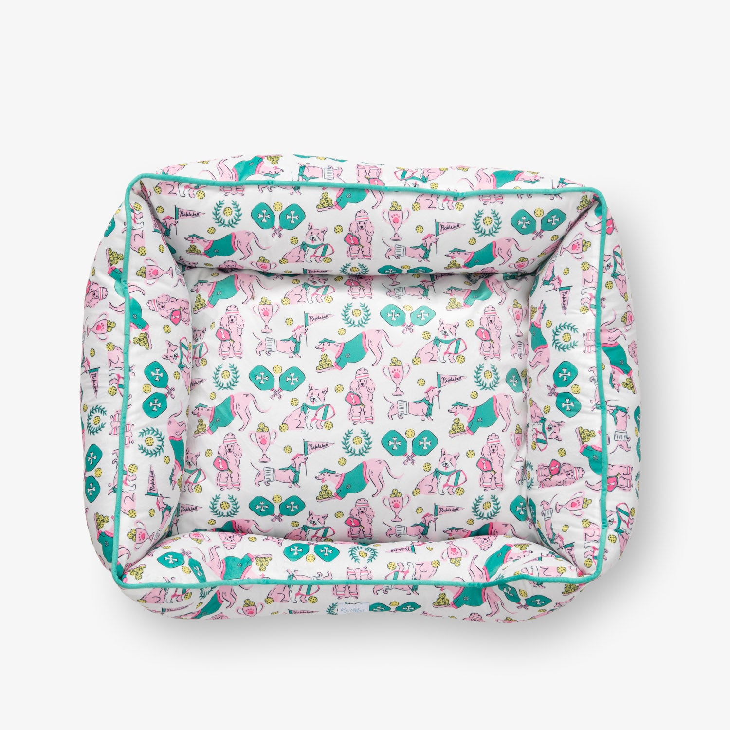Pickleball pups pet bed set on a white surface.