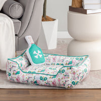 Pickleball pups dog toy and pet bed set styled in a room.