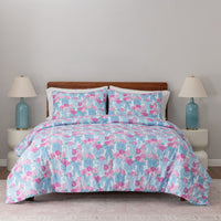 Krissy Mast floral printed comforter set decorated on a bed.