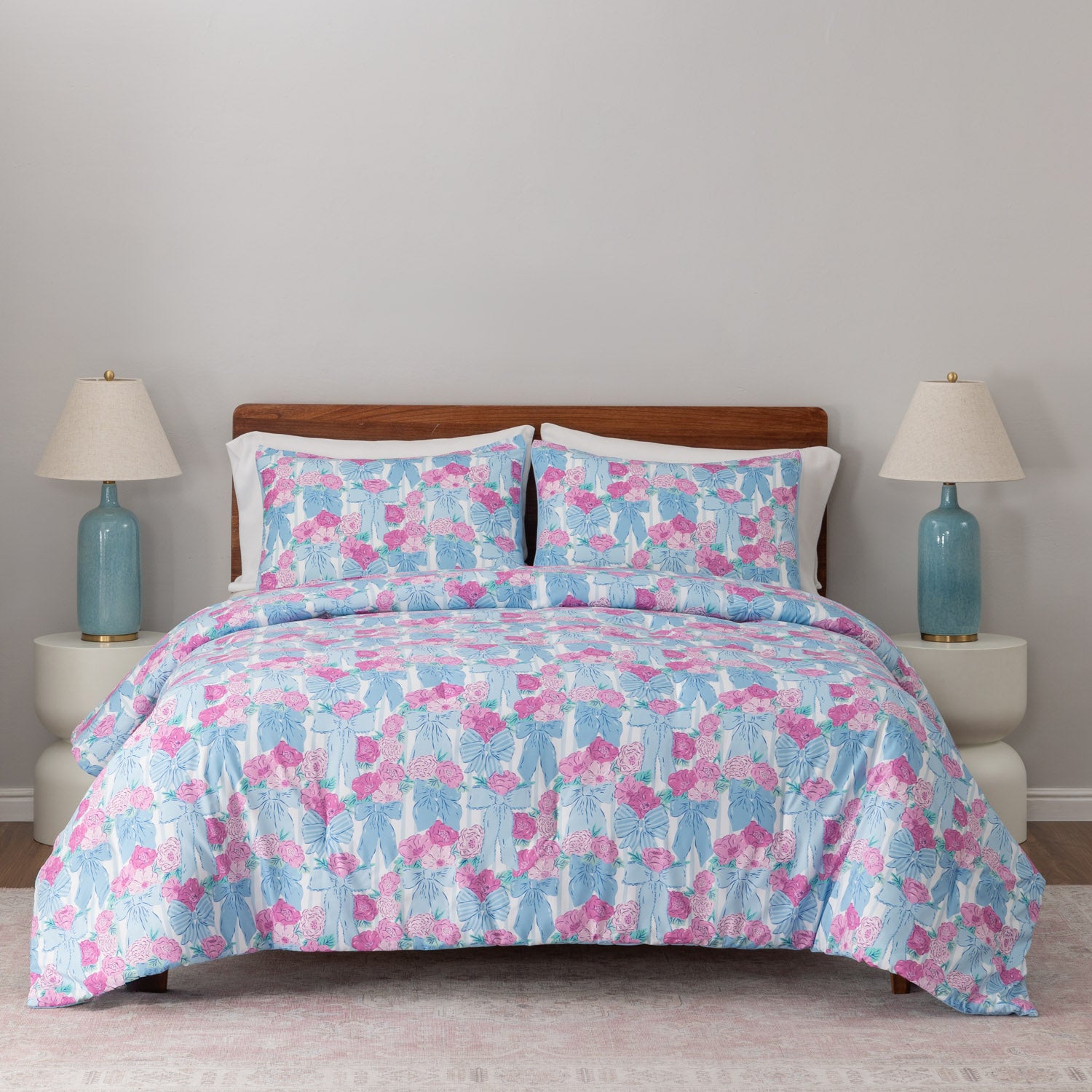 Krissy Mast floral printed comforter set decorated on a bed.