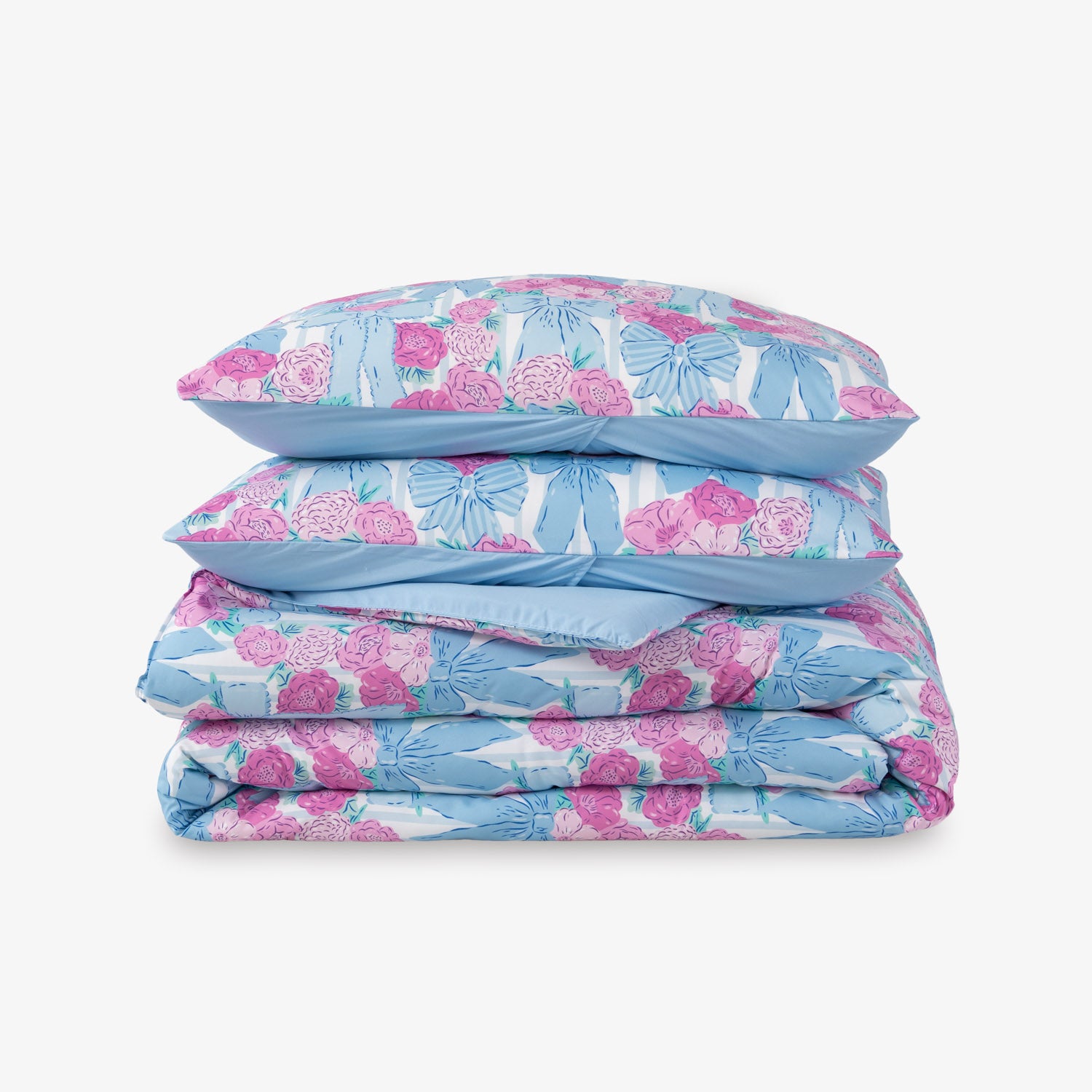 Krissy Mast floral printed comforter set folded neatly on a white surface.