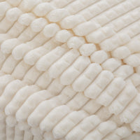 A close up of a cream VelvetLoft waffle blanket.