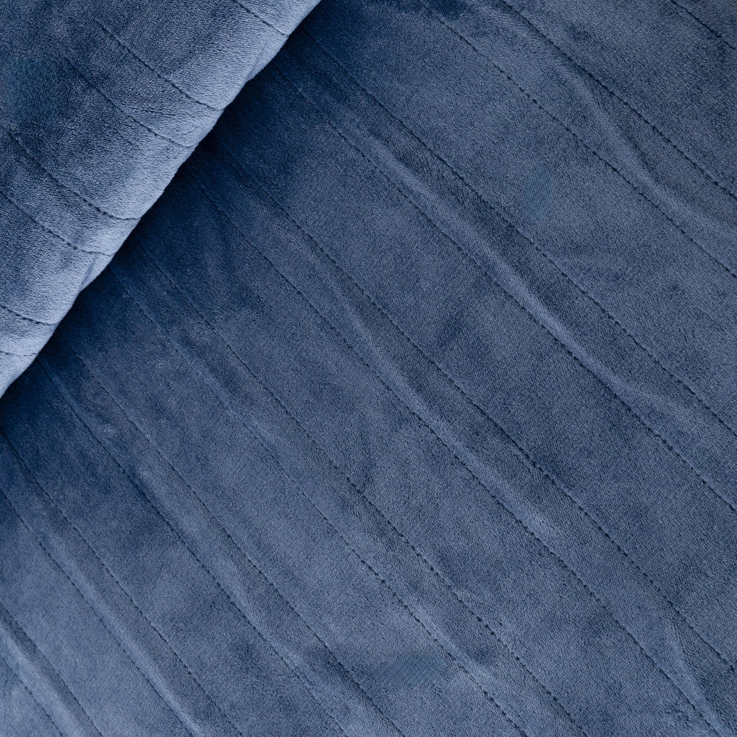 Close-up of blue fabric with a textured pattern