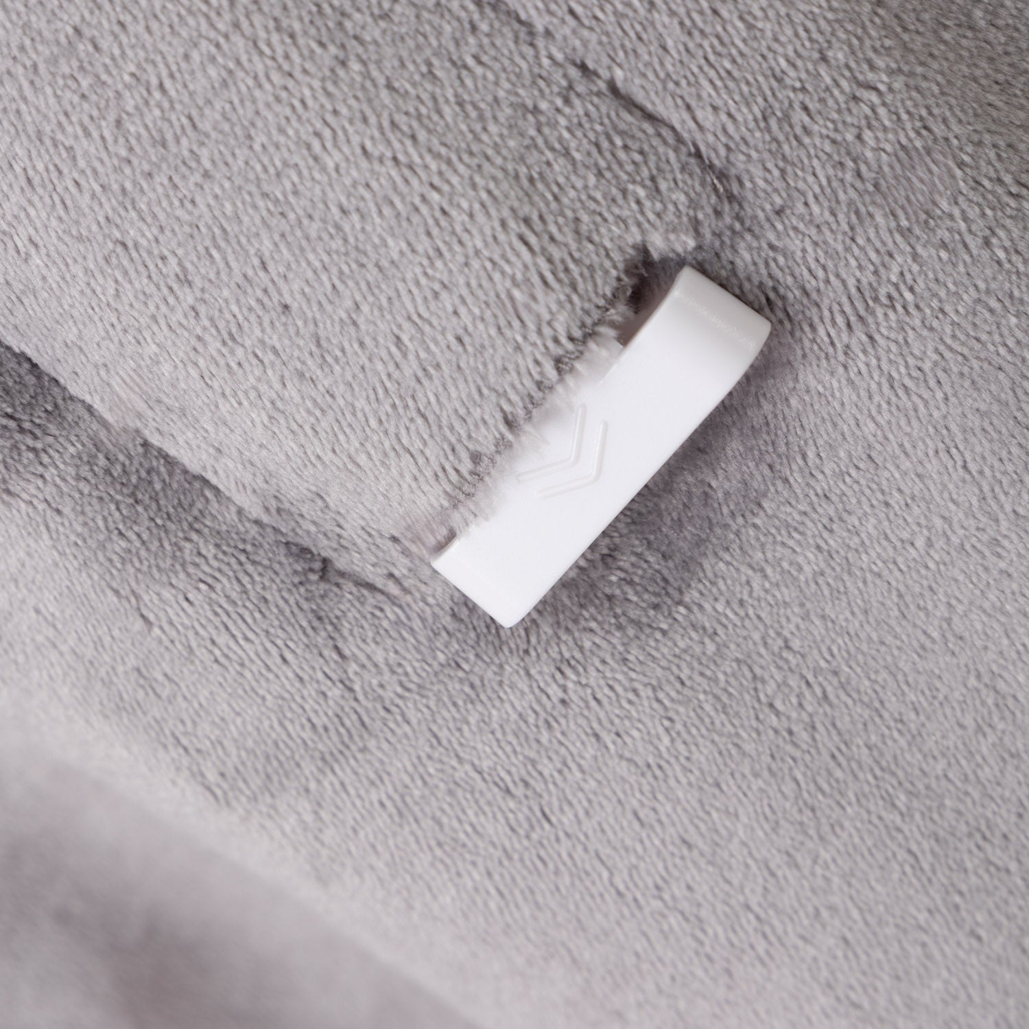 White connector on a textured gray surface
