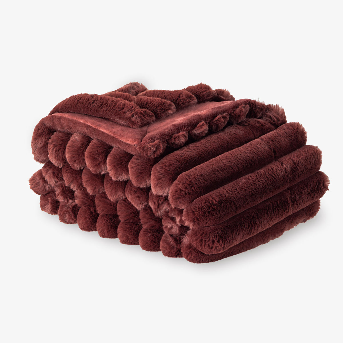 Folded burgundy blanket on a white background