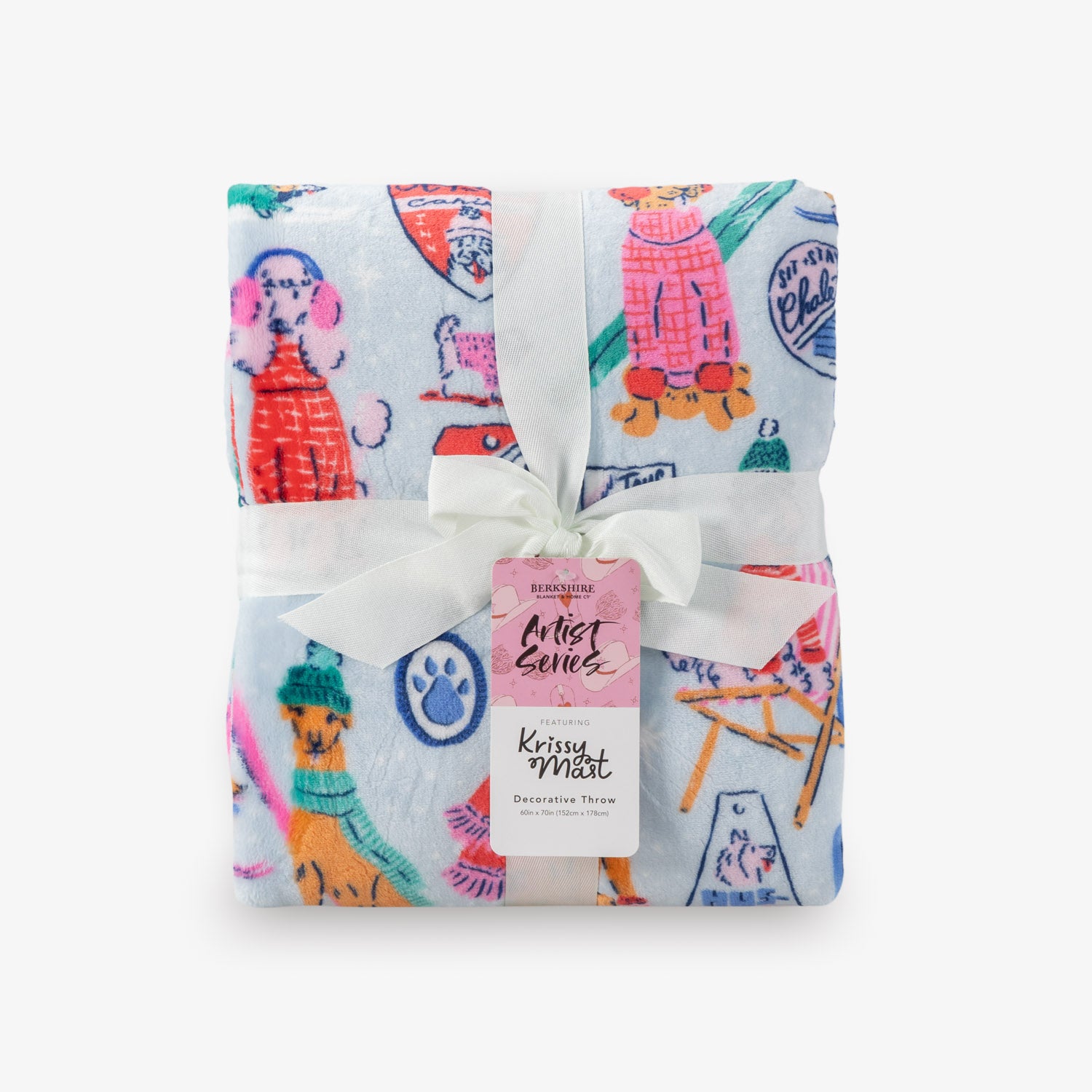 Folded decorative throw blanket with colorful dog illustrations and a white ribbon on a white background.