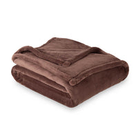 A brown PrimaLush Throw folded neatly on a white surface.