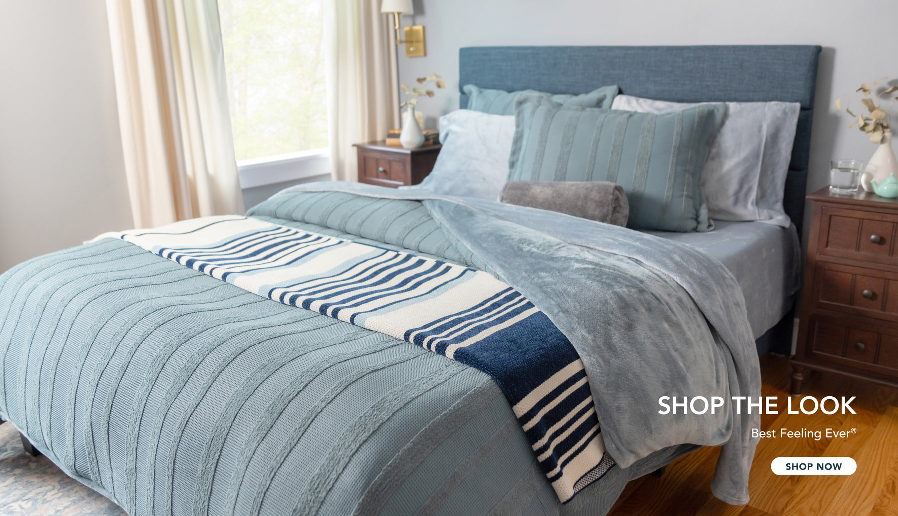 Shop the look. Best feeling ever®. Image of a bed styled with blue products in various textures.
