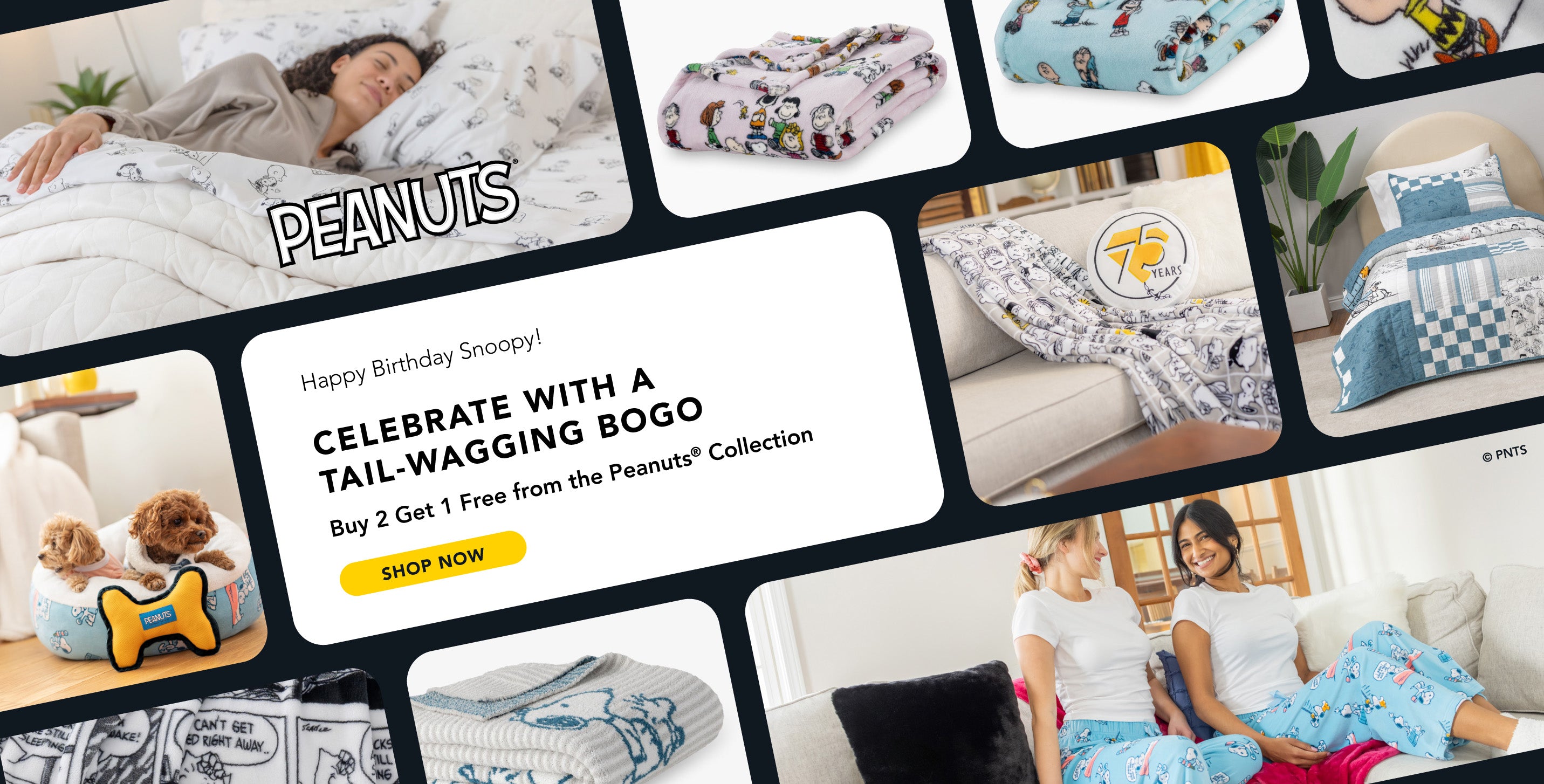 A promotional collage celebrating Snoopy’s birthday and the Peanuts® 75th anniversary with cozy home items. The centerpiece text reads: “Happy Birthday Snoopy! Celebrate with a Tail-Wagging BOGO. Buy 2 Get 1 Free from the Peanuts® Collection” with a yellow “Shop Now” button below. Surrounding images feature Peanuts-themed products including printed blankets, a comforter, pajama pants, a dog bed with two small dogs and a yellow bone-shaped toy, and a round pillow that says "75 Years." Two women wearing match