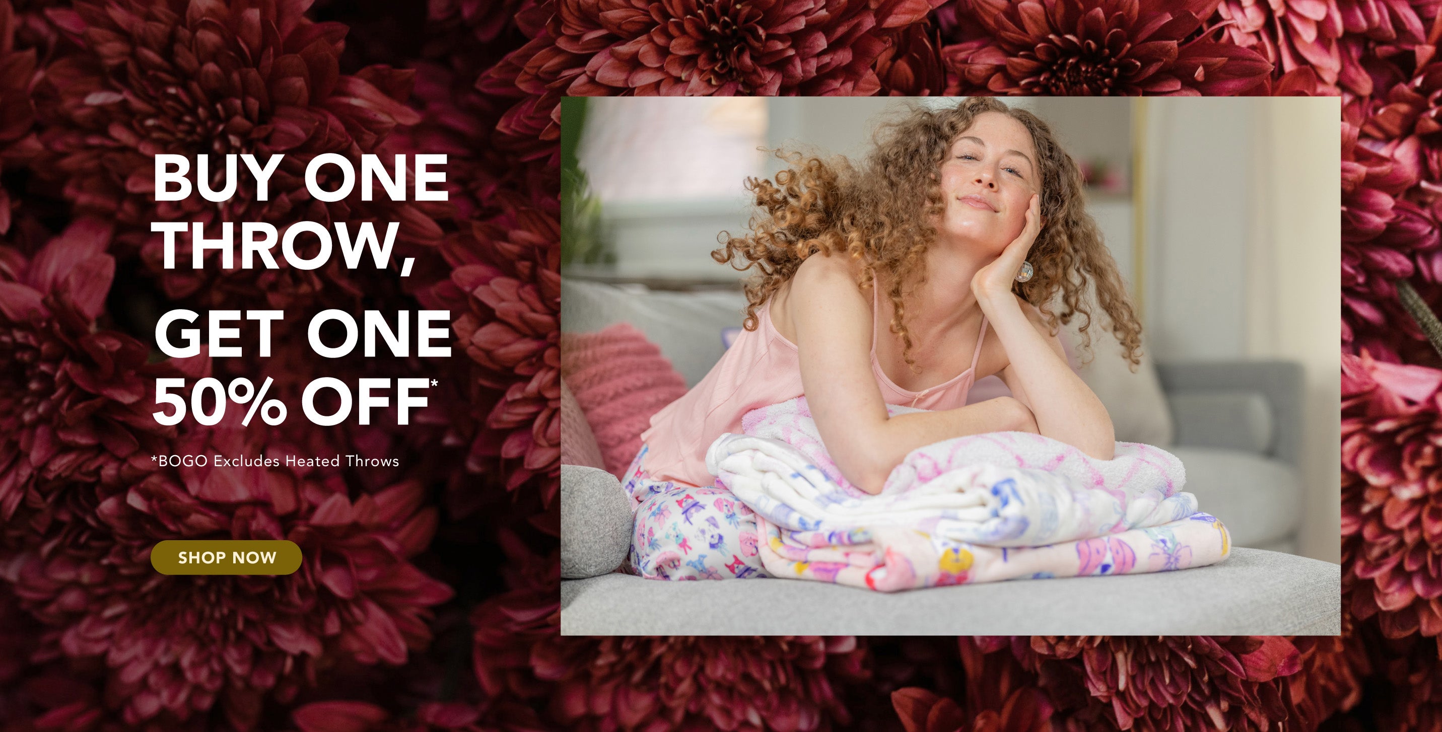 Buy One Throw, Get One 50% Off*
*BOGO excludes Heated Throws
Photo of model with a stack of colorful throws, red floral background