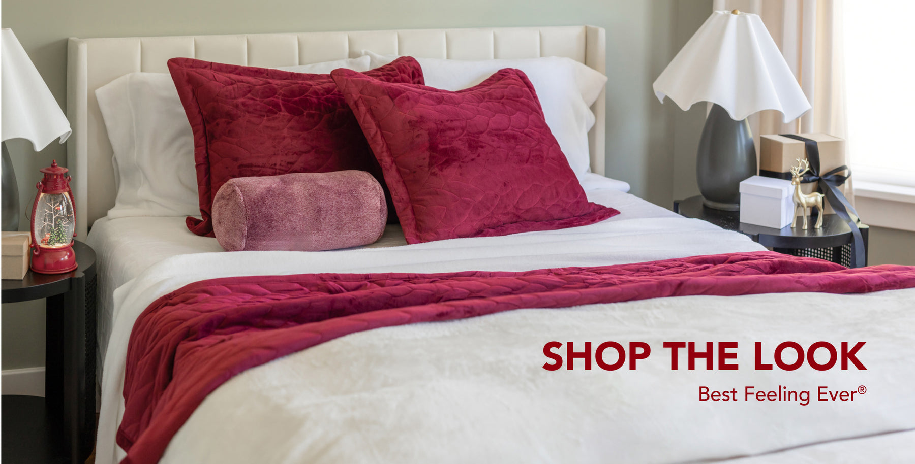 Shop the Look. Best Feeling Ever®. Image of a bed styled with red and white products for a holiday vibe.
