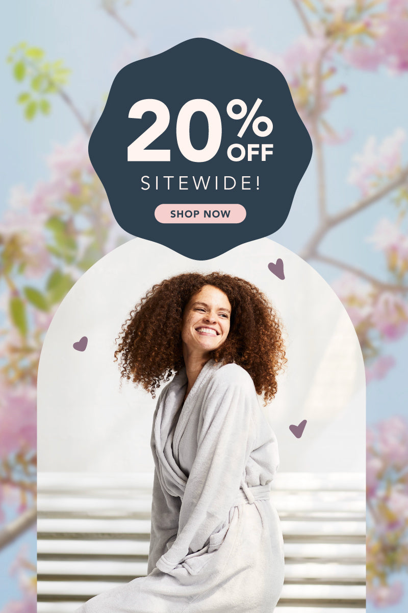 20% off sitewide theme banner featuring  a woman wearing our VelvetLoft robe.