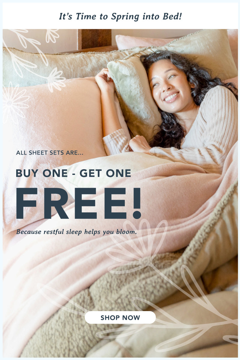 It's time to spring into bed! All sheet sets are buy1 get 1 free! Because restful sleep helps you bloom. Shop now. Image of girl in bed made with pink sheets and a green comforter set, floral drawing overlaid. 