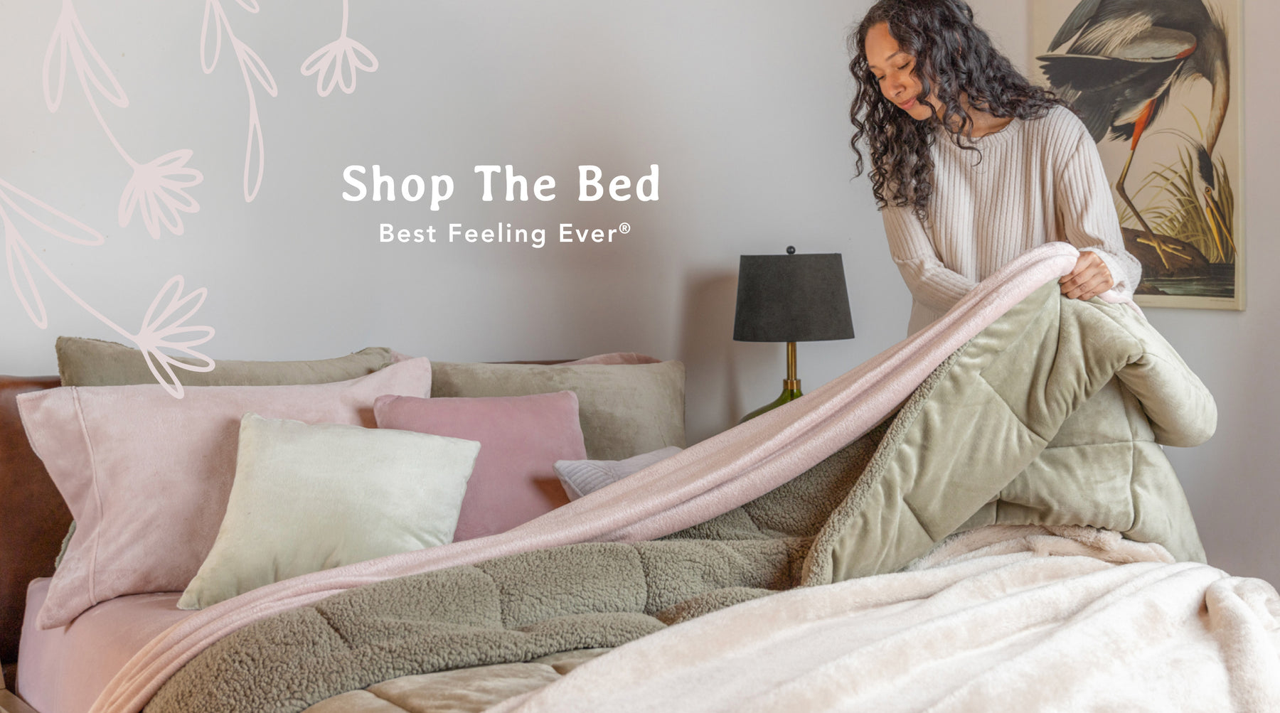 Shop the bed. Best Feeling Ever®. Image of a girl standing beside her bed that is made with pink sheets, a green comforter, and a tab throw on top. 